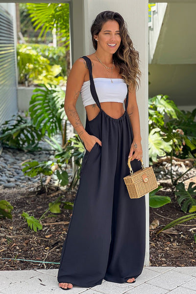 black jumpsuit with pockets and tie back