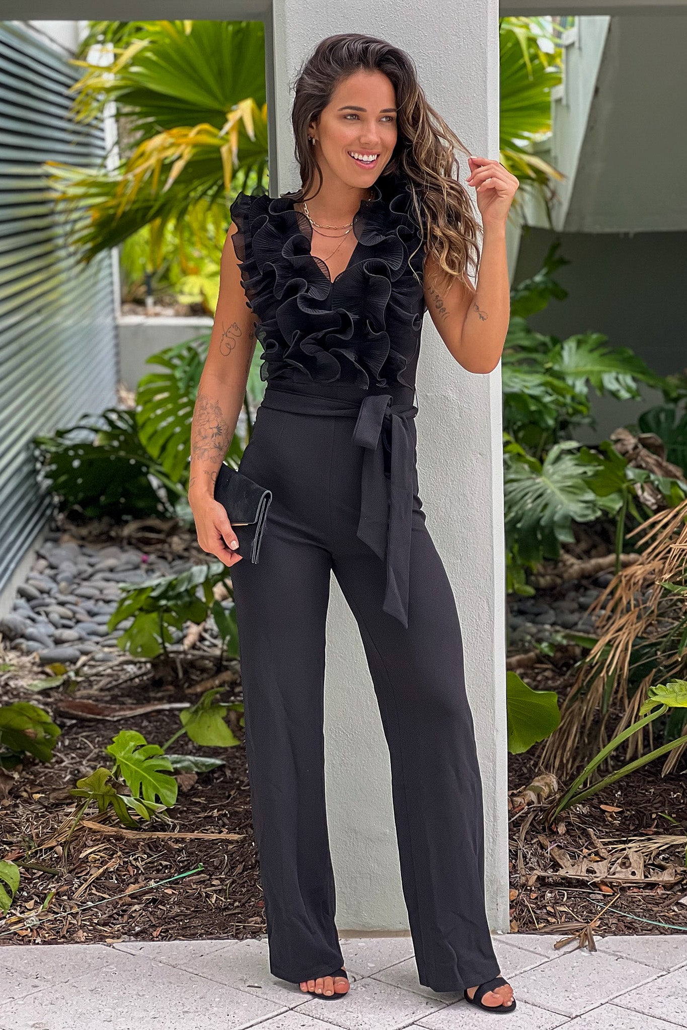 black jumpsuit with ruffle top