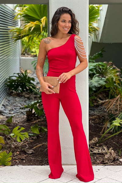 red one shoulder jumpsuit with faux pearl detail