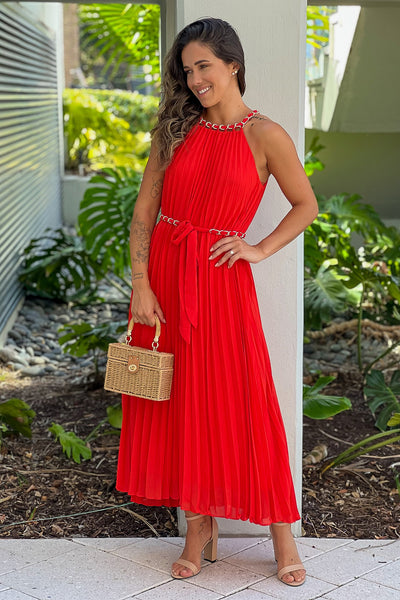 red pleated dress with chain belt
