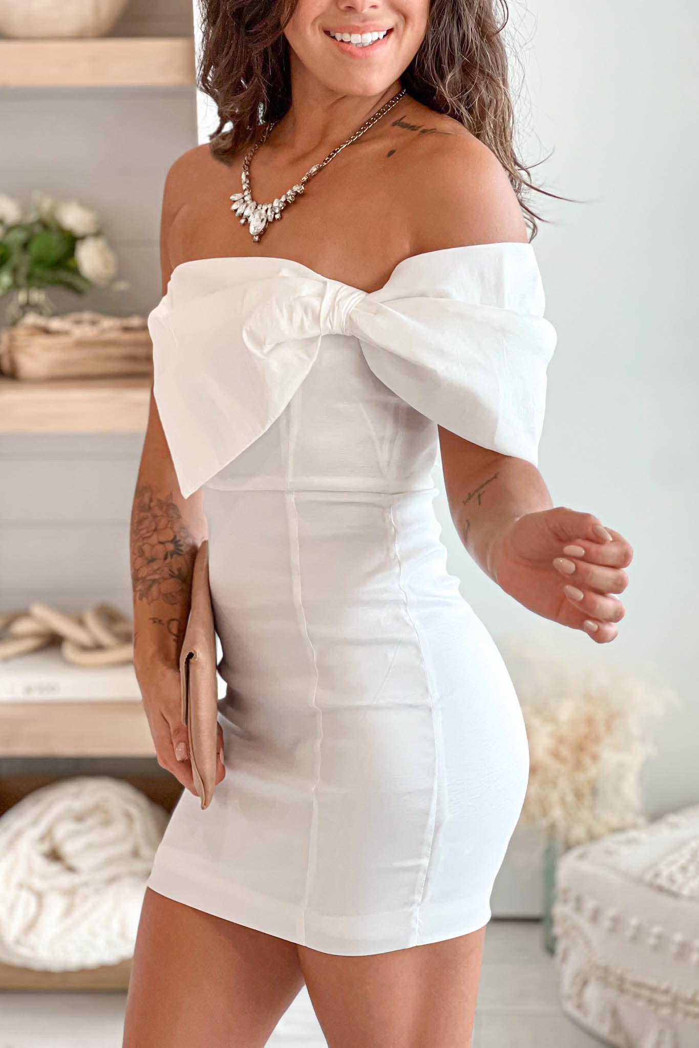 white off shoulder mini dress with bow detail