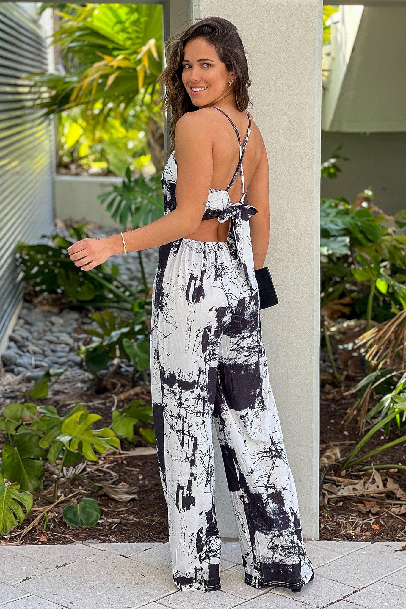 black and white jumpsuit with criss cross back