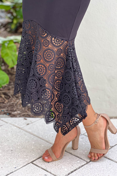 black dress with crochet trim
