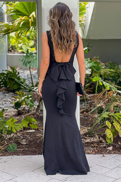 black maxi dress with open back and bow