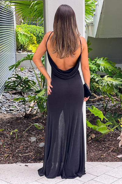 black maxi dress with slit and draped back