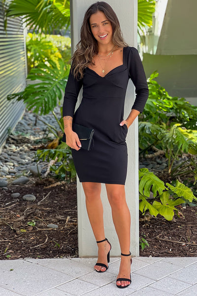 black midi dress with 3/4 sleeves and pockets