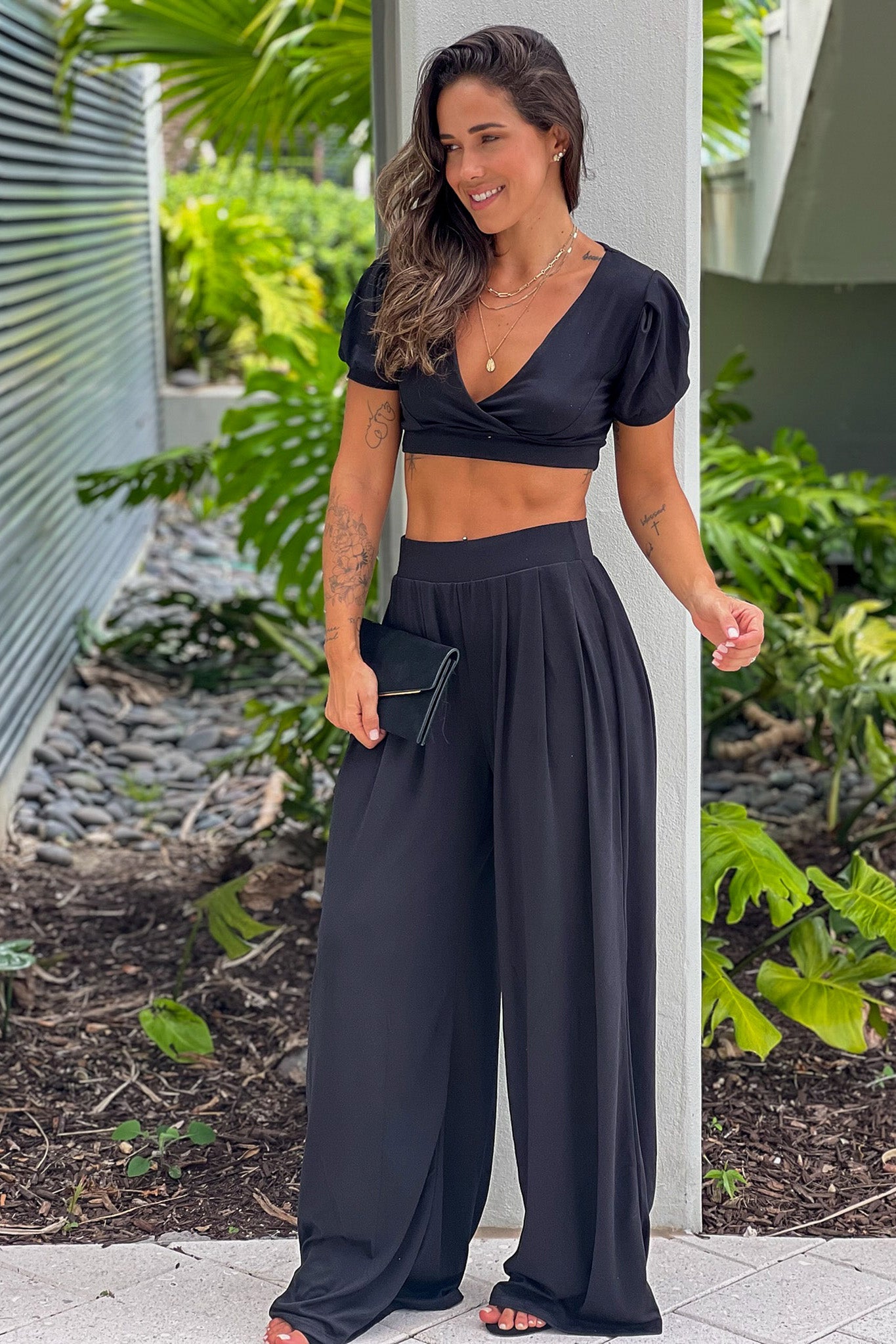 black pants and crop top outfit