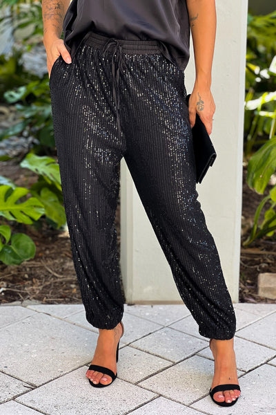 black sequin pants and top outfit