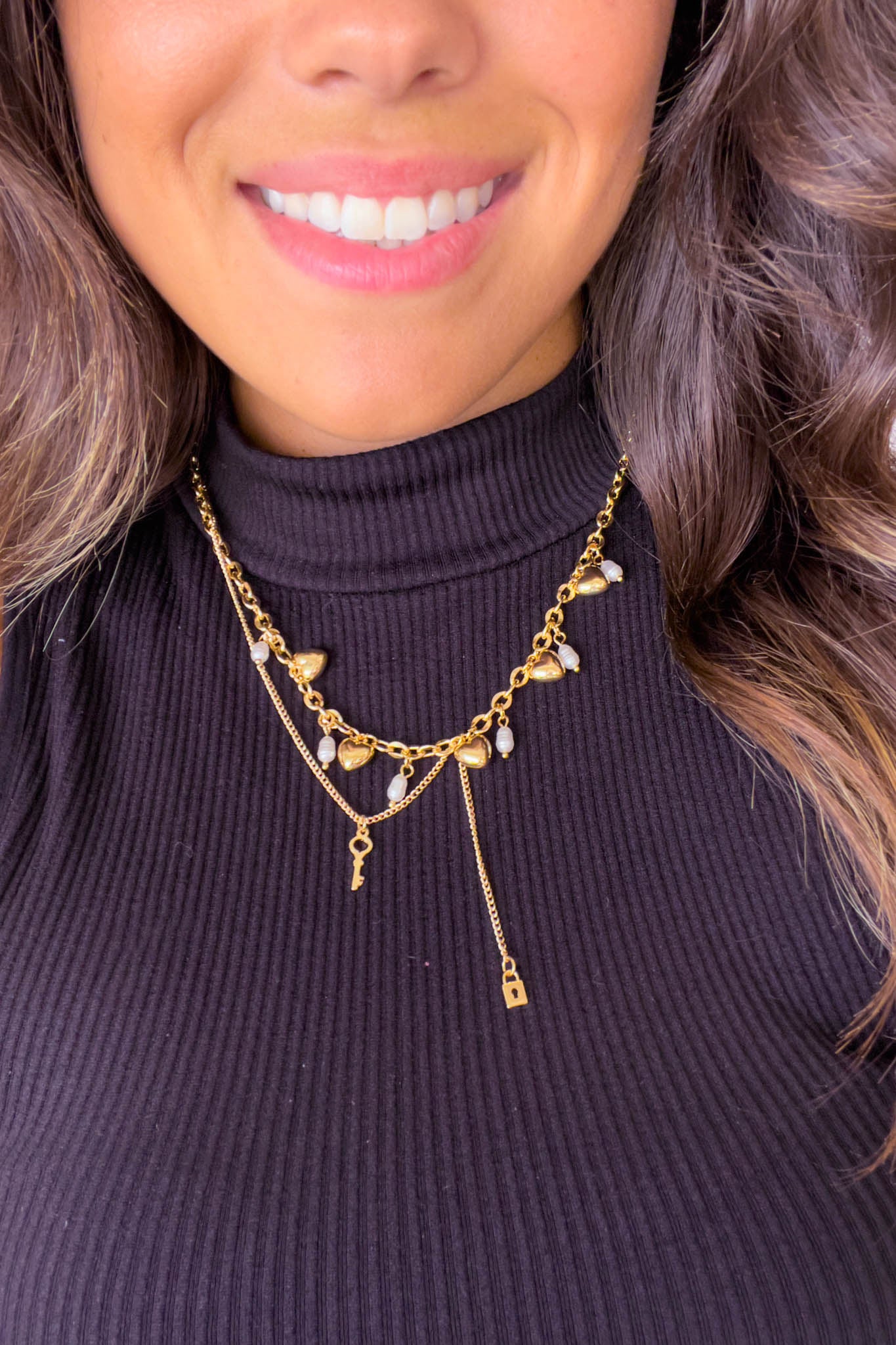 gold asymmetric necklace with heart drops