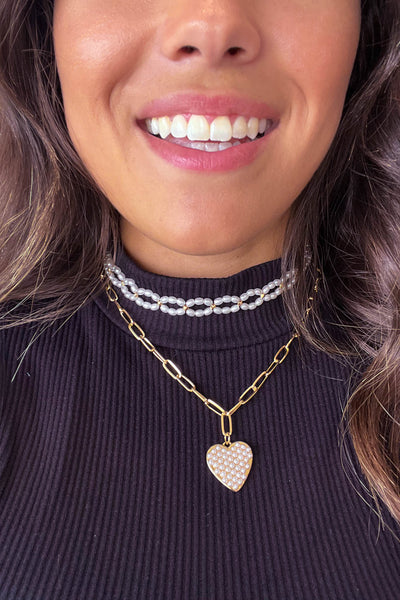 gold chain and pearl necklace with heart pendant
