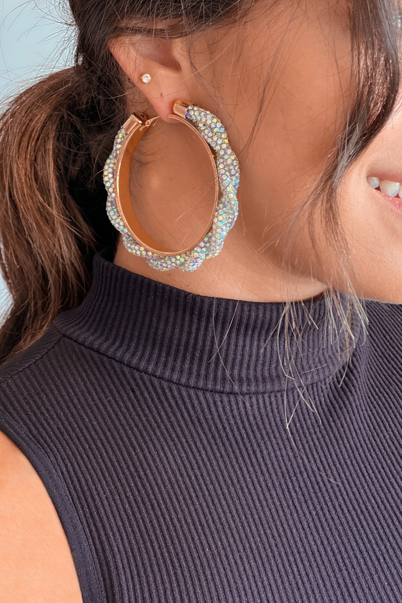 gold hoop earrings with iridescent rhinestones