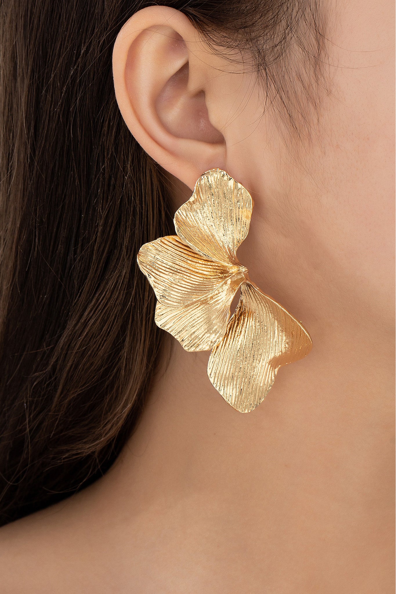 gold textured flower earrings