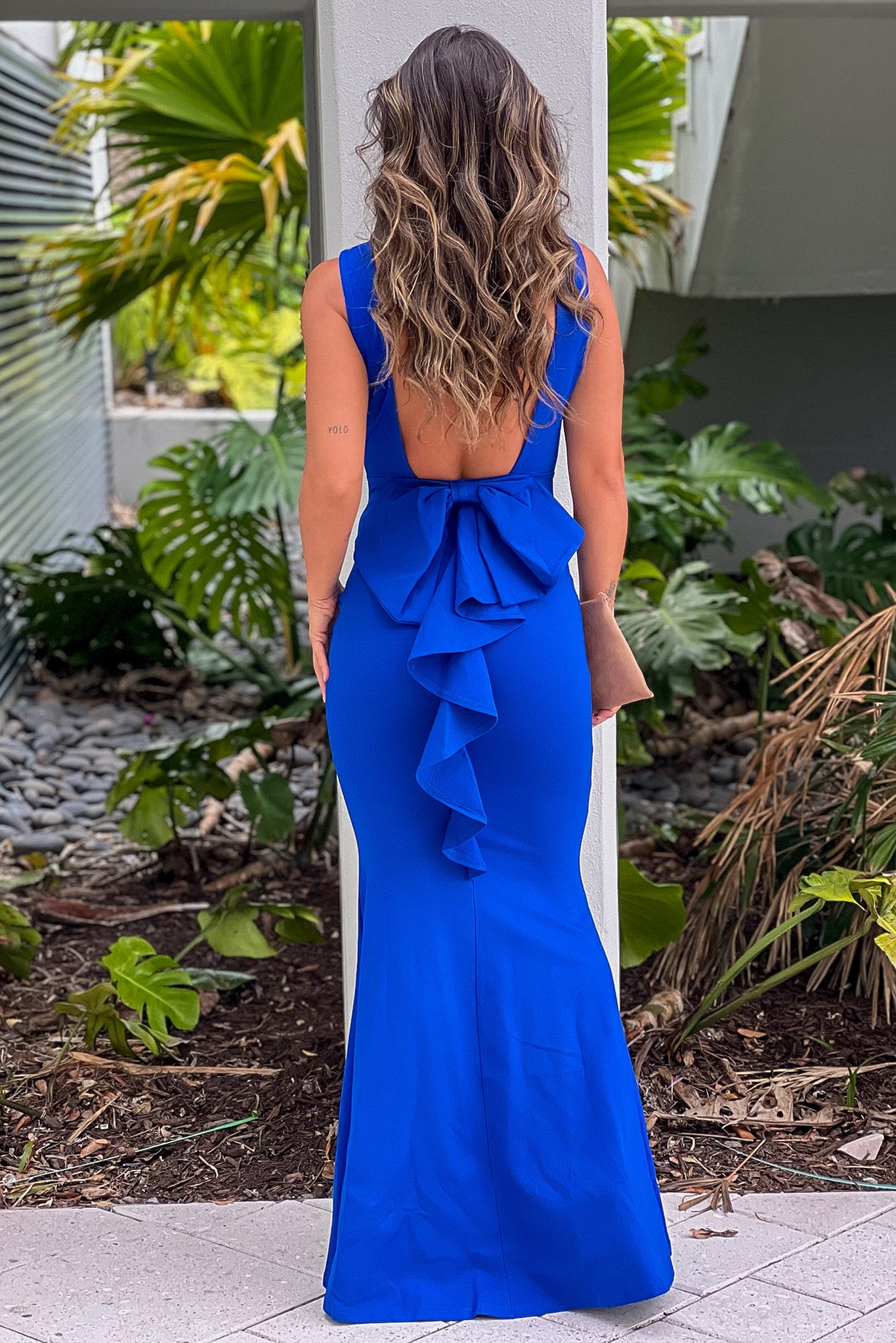 royal blue maxi dress with open back and bow