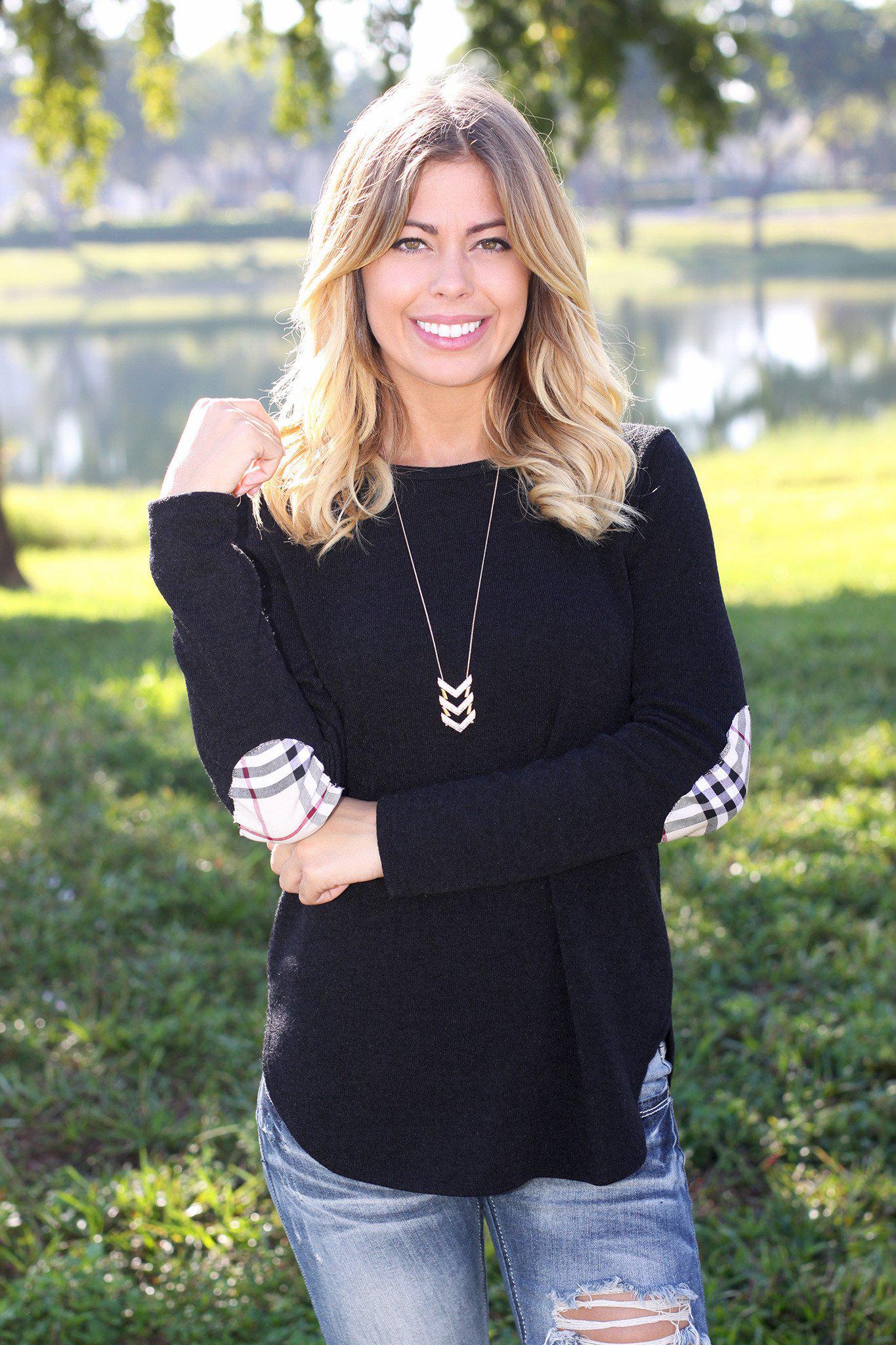black sweater top with plaid elbow patches