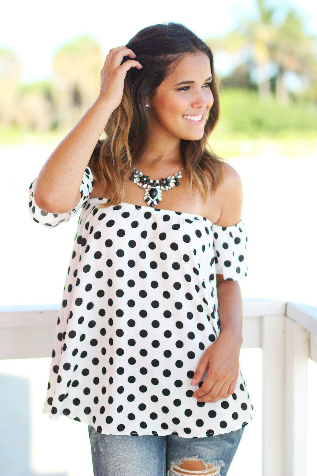 white polka dot off the shoulder top
