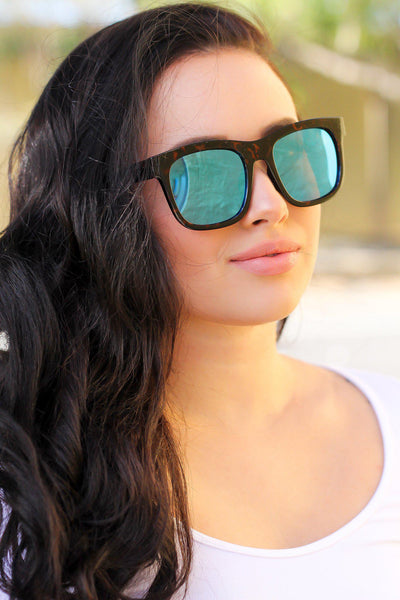 tortoise frame sunglasses with blue lenses