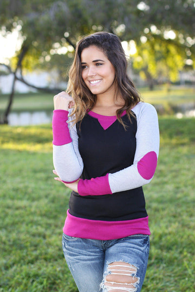magenta and black top with elbow patches