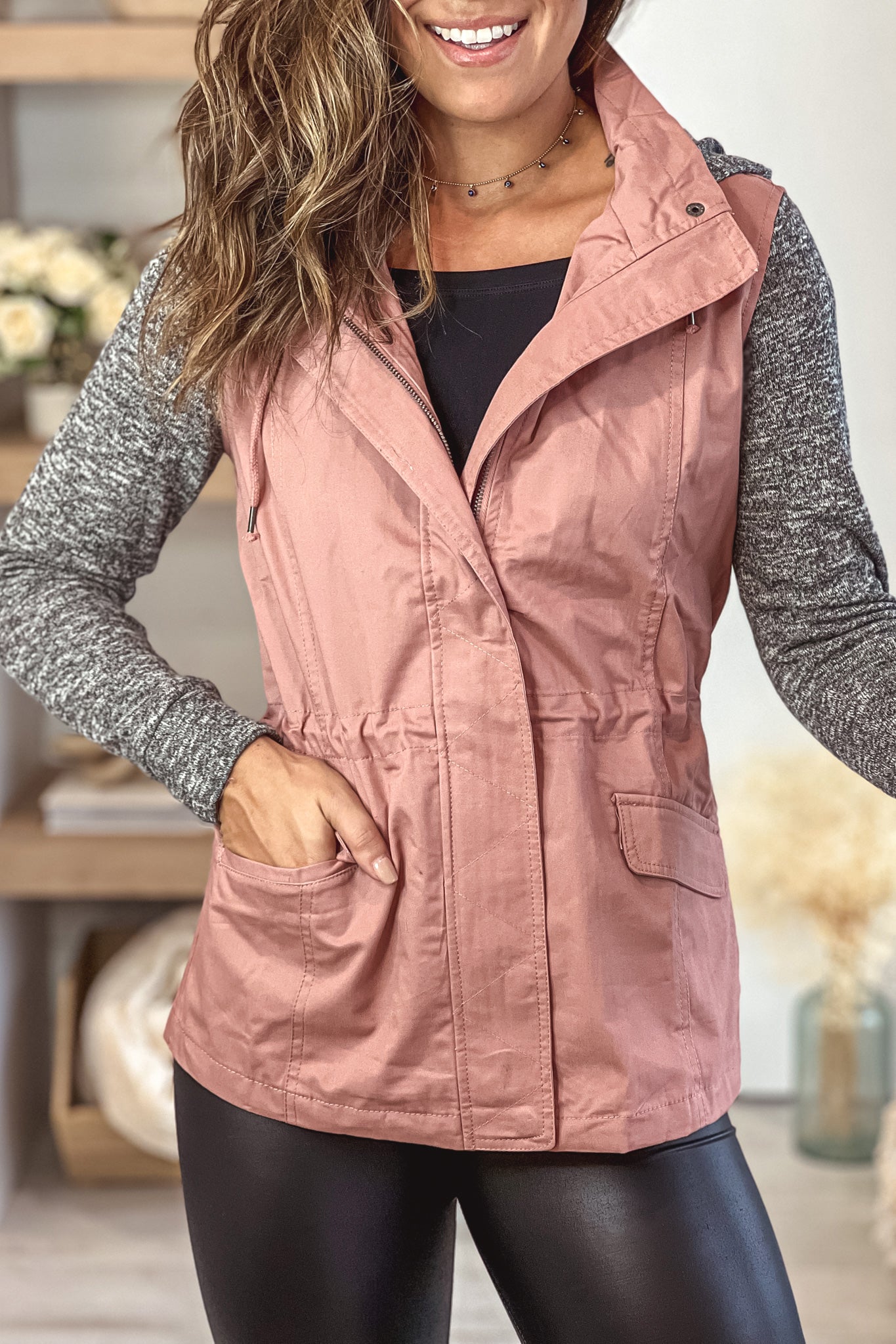 mauve jacket with gray hood and sleeves