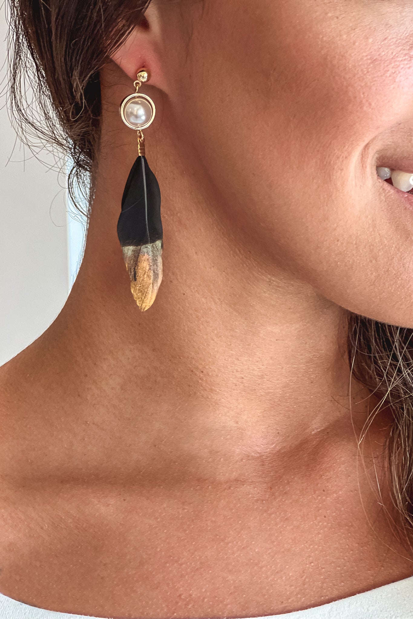 black and gold dipped feather earrings