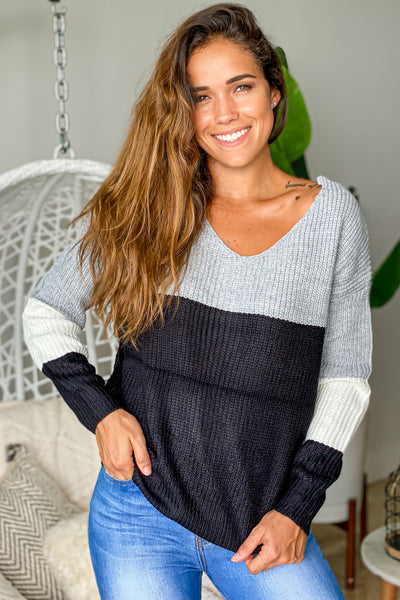 black and gray sweater with twist detail