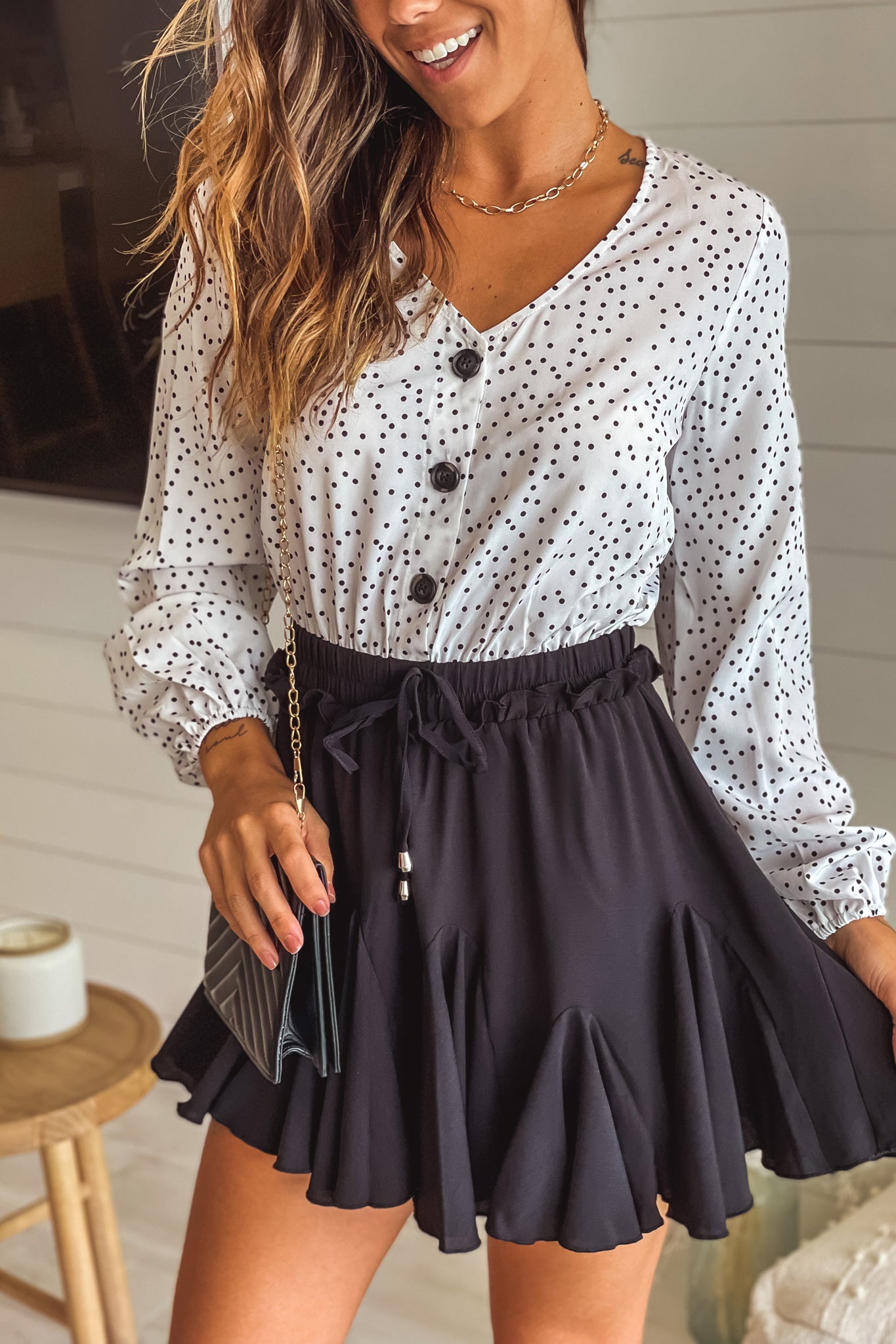 black and white polka dot ruffled short dress with long sleeves