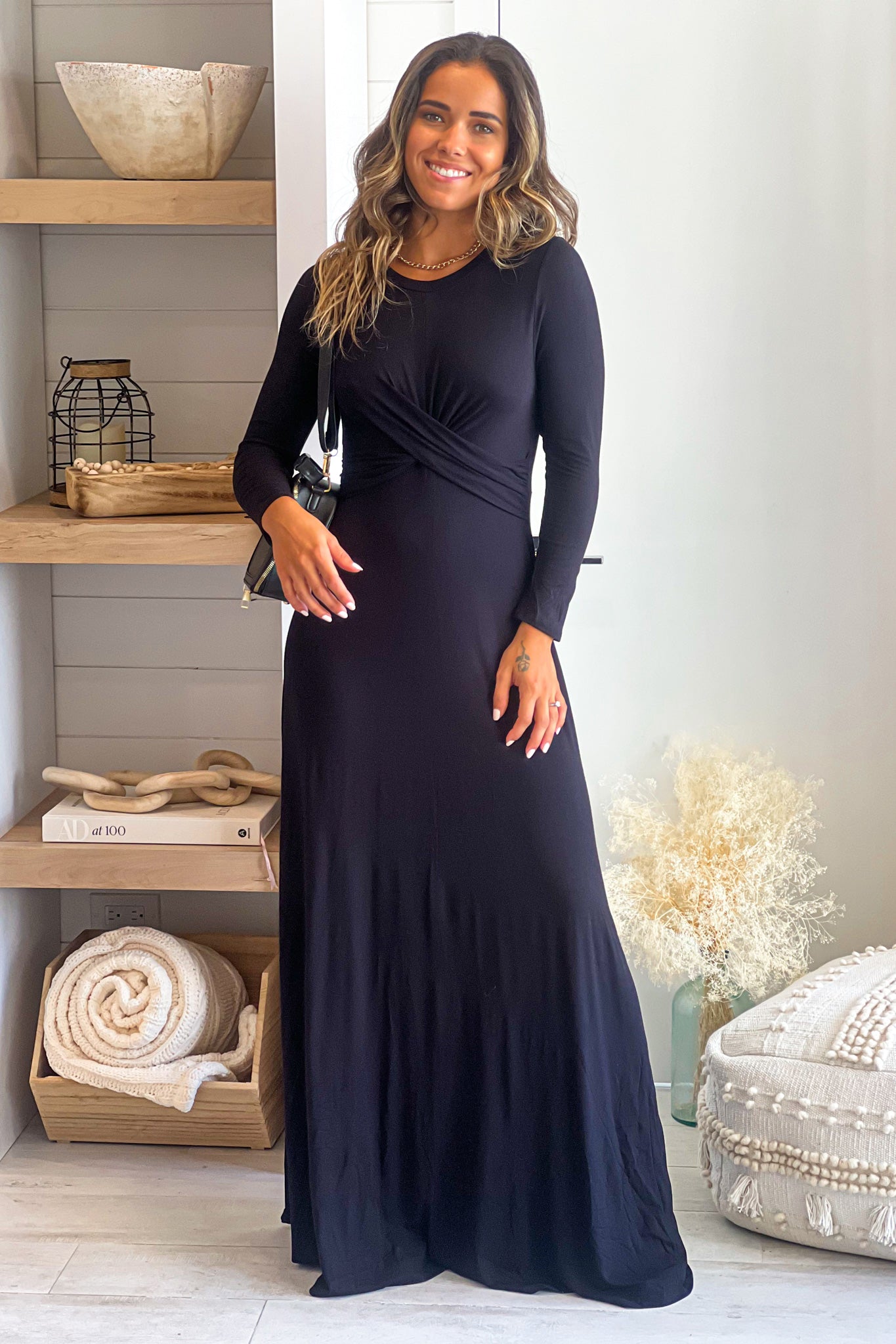 black maxi dress with long sleeves and twisted front