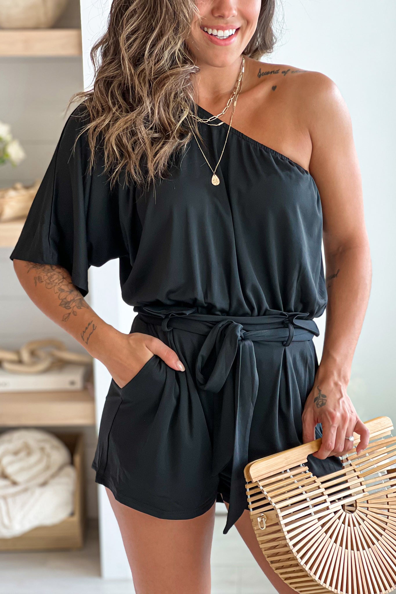 black one shoulder romper with pockets and tie waist