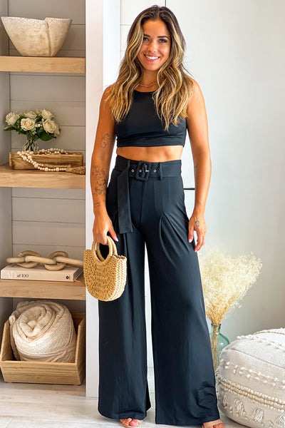 black top and pants set with belt