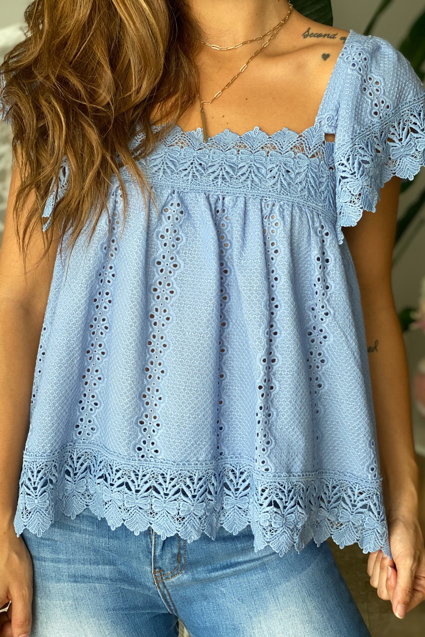 Lifestyle blue top with embroidered detail