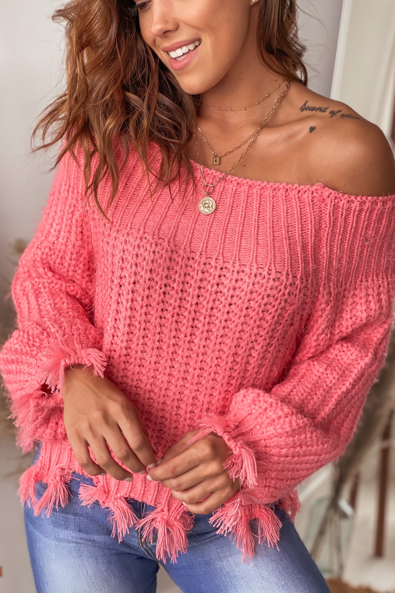 coral off shoulder distressed sweater