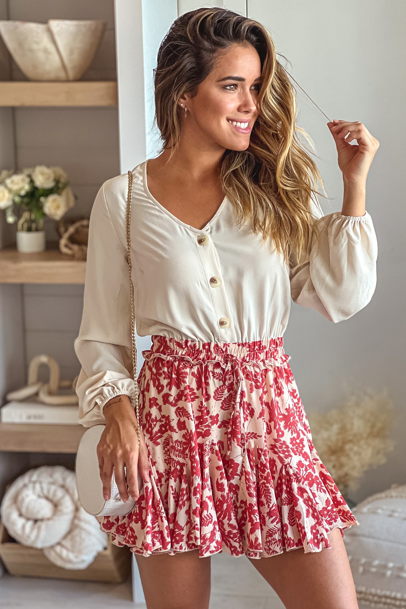cream and cranberry romper with long sleeves