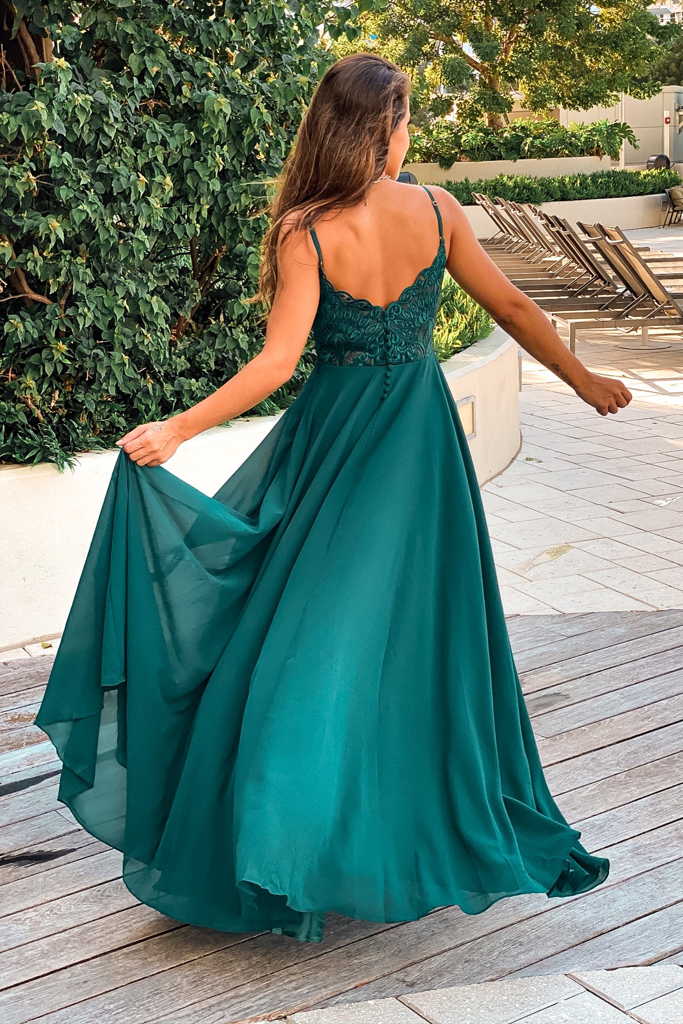 emerald maxi dress with embroidered back and button detail