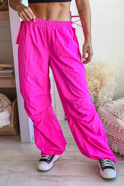 hot pink relaxed fit pants with adjustable hem