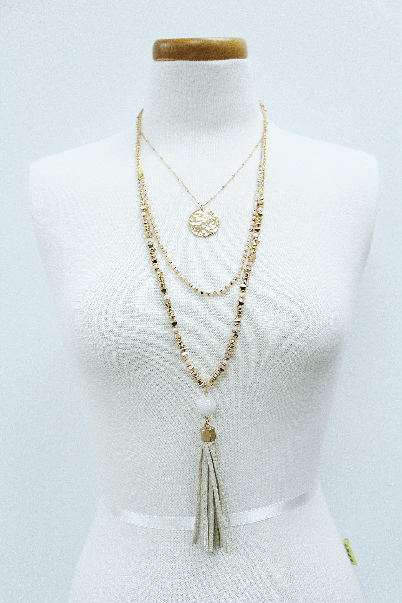 ivory and gold layered necklace with tassel