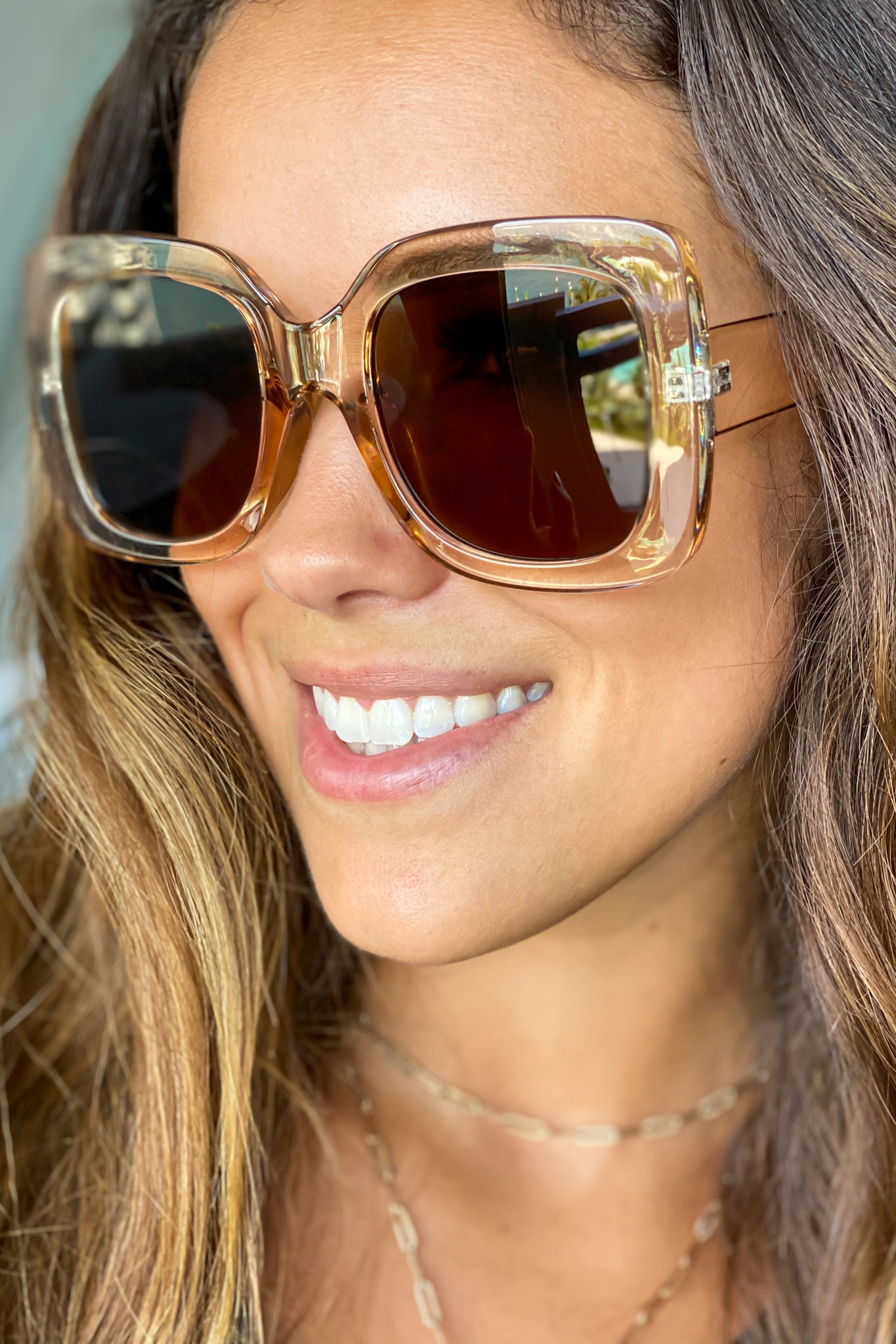 light brown wide frame sunglasses