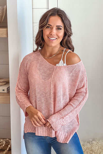 light pink v-neck knit top with long sleeves