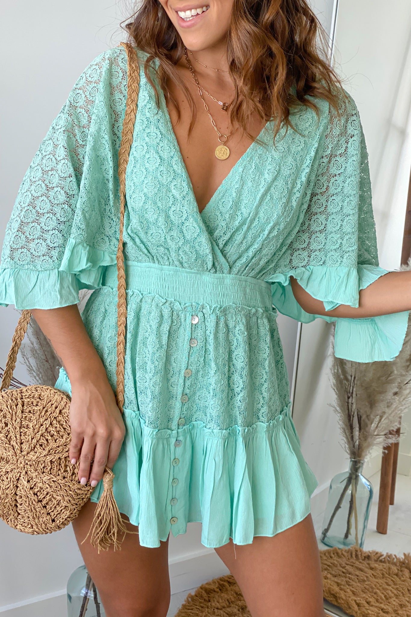 mint lace romper with bell sleeves