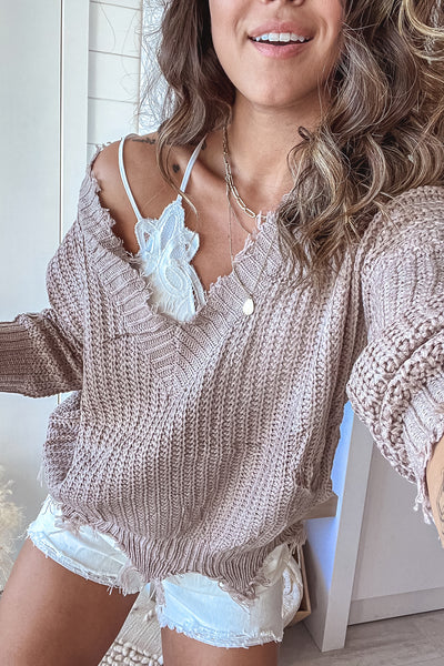 taupe gray v-neck frayed sweater