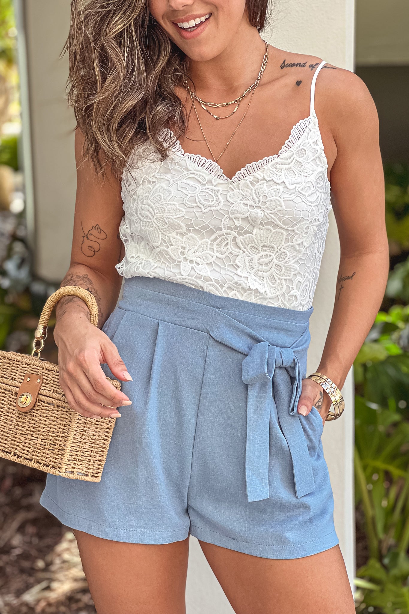white and blue romper with lace detail