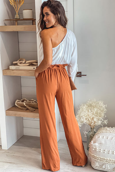 white and camel one shoulder jumpsuit