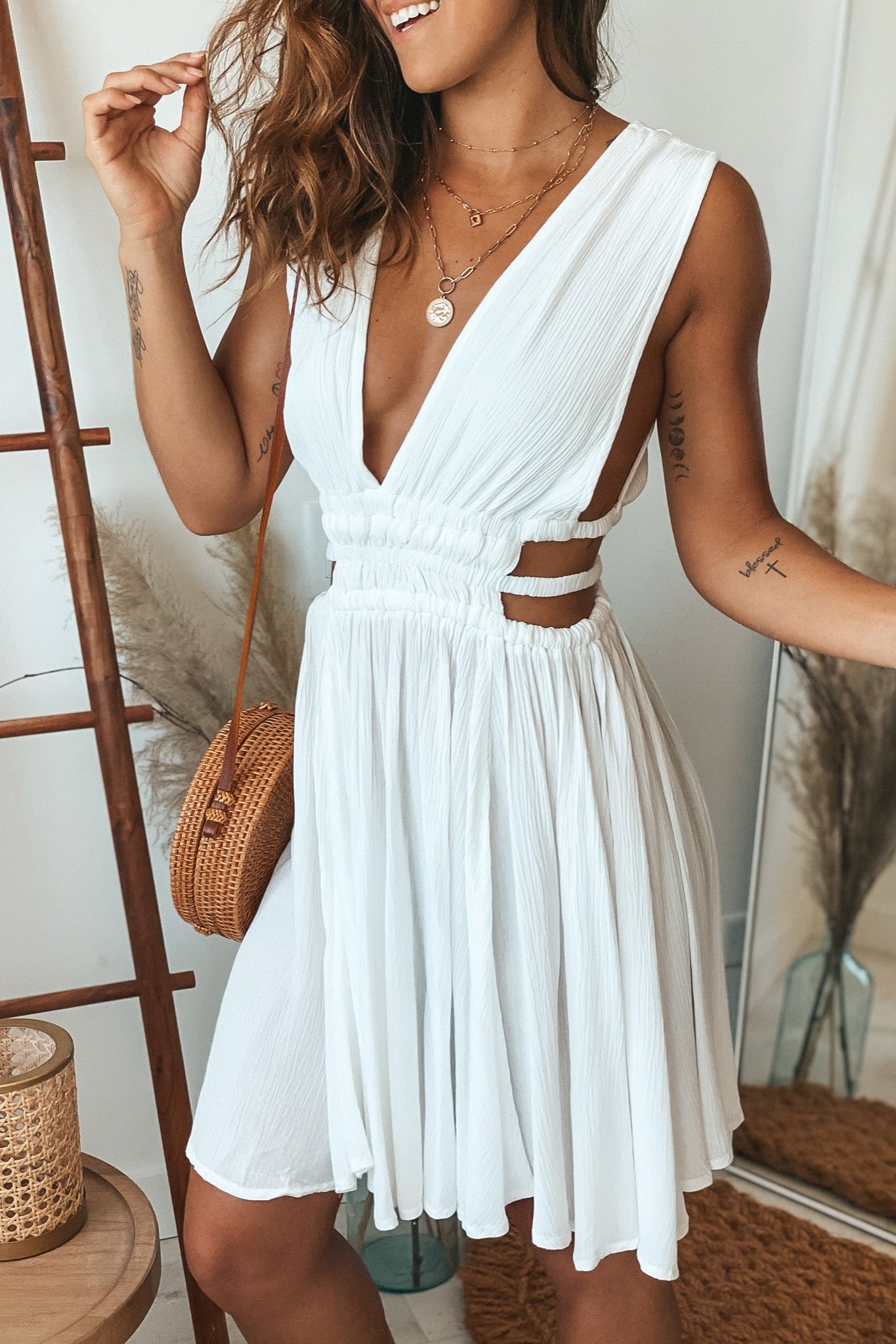 white v-neck short dress with side cut outs